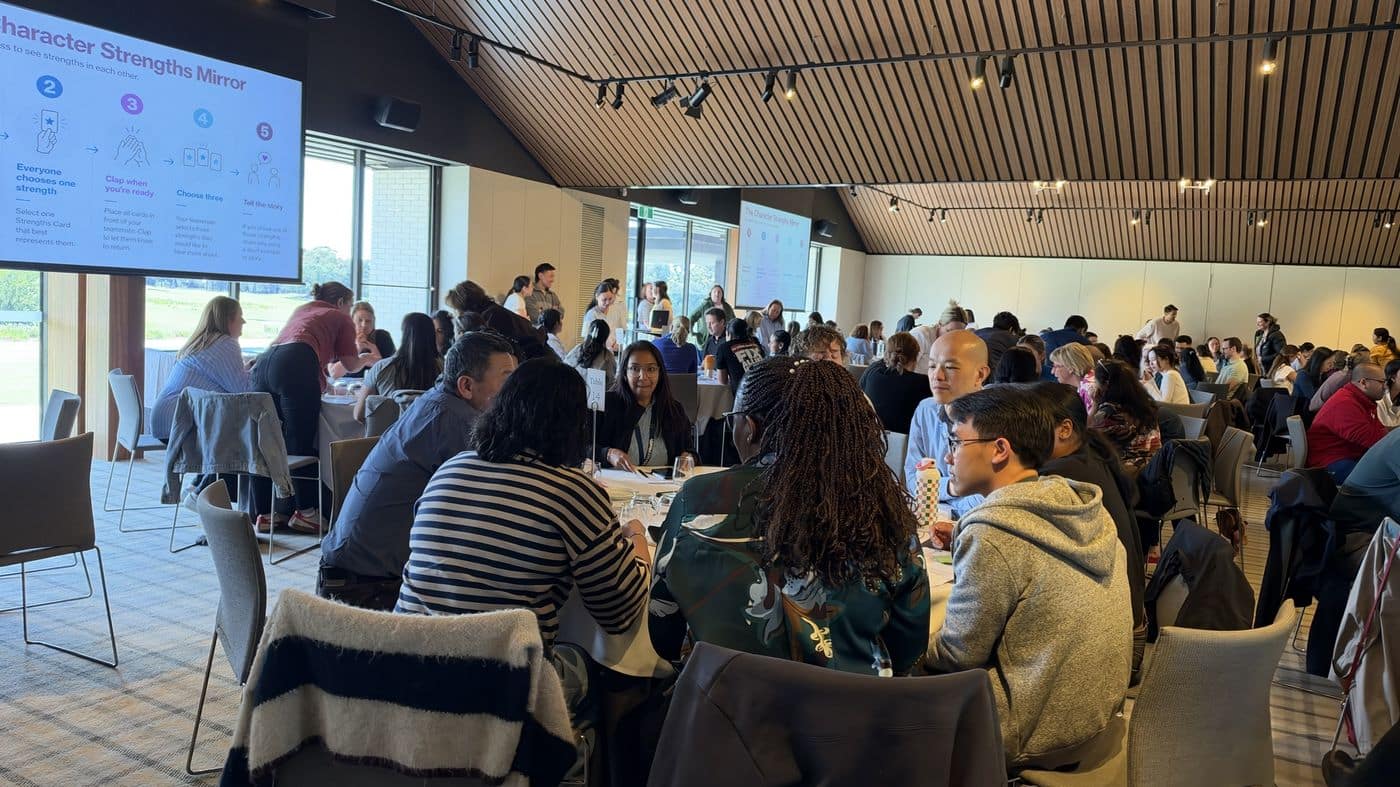 Health team at tables during a Finding Joy at Work staff wellbeing day with Jane Wundersitz